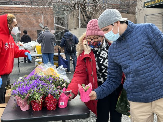 Miguel Rodriguez of Elmhurst picks up a small plant for his daughter, February 22nd, 2022